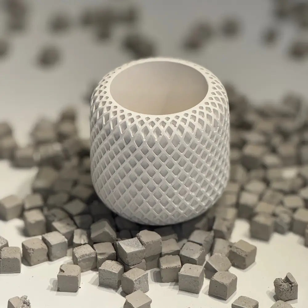 Minimalist plaster ribbed jar with lid on neutral surface