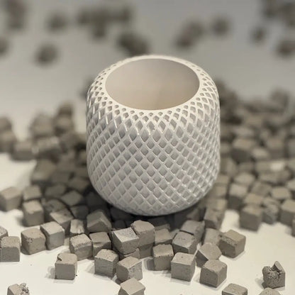 Minimalist plaster ribbed jar with lid on neutral surface